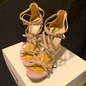 Pink strappy suede heels.